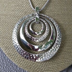 Women's silver tone runway statement necklace.